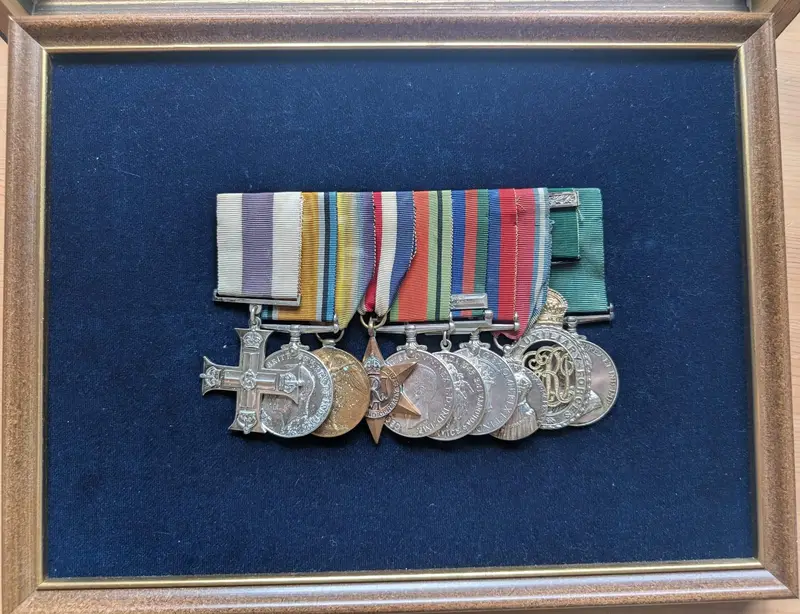 Robertson's ten medals on one bar, framed