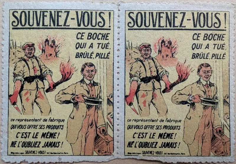 Two joined French propaganda poster-stamps: a torch-bearing German soldier beside a civilian salesman, with the slogan “Souvenez-Vous! … C'est le même! Ne l'oubliez jamais!”